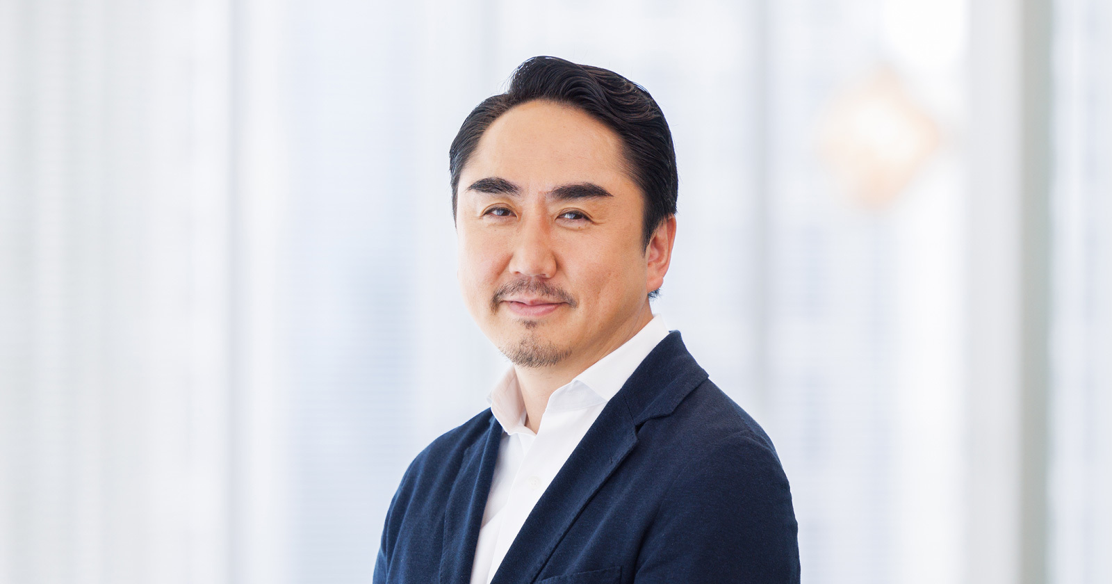 Bust shot of LY Corporation President and CEO Takeshi Idezawa